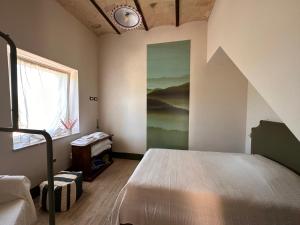Postel nebo postele na pokoji v ubytování Cascina La Vigna Country House