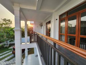 a porch of a house with a balcony at Regno Residence the Infinity by Netflix in Panadura
