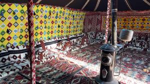 a room with colorful walls and a carousel at شاليه الفاخريه in Madain Saleh