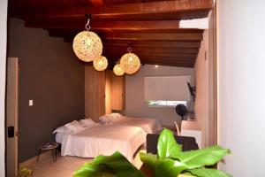 Ένα ή περισσότερα κρεβάτια σε δωμάτιο στο Moderno Apartamento Medellin con Jacuzzi y Aire Acondicionado
