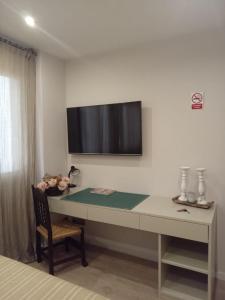 Телевизия и/или развлекателен център в Suite con baño privado en apartamento de lujo.