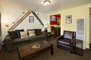 
a living room filled with furniture and a couch at Holiday Haus in Mammoth Lakes

