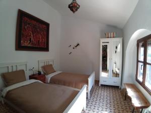 Postel nebo postele na pokoji v ubytování Molino Mairena