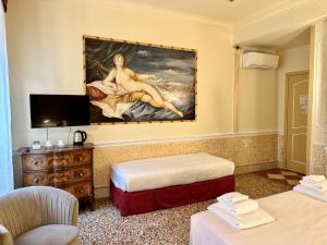 TV a/nebo společenská místnost v ubytování Casa Alla Fenice