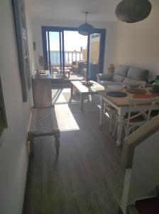 a living room with a couch and a table at L'AUNISA in El Campello