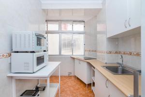 Kuchyňa alebo kuchynka v ubytovaní Impresionante vista al mar - Elegante apartamento