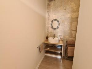 a bathroom with a sink and a mirror at Demeure restaurée avec chambres privatives, proche Loire, vignes et activités outdoor - FR-1-590-240 in Beaulieu-sur-Loire +27 photos