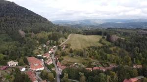 an aerial view of a small village in the mountains at Gite de La Falle in Plaine