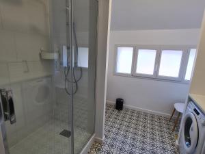 a bathroom with a shower with a glass door at Gîte en Sologne au calme avec étang, proche d'Orléans et châteaux, idéal randonnées et pêche - FR-1-590-242 in Vannes-sur-Cosson +22 photos