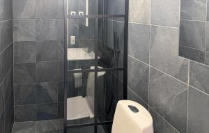 a bathroom with a toilet and two sinks at Nice Apartment In Idre With House A Panoramic View in Idre