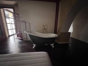 a large bathroom with a bath tub in a room at Magic Loft Underground in Rome