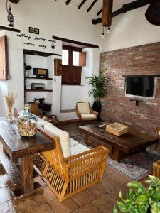 a living room with a couch and a table at Casa Real Barichara in Barichara