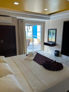 Ein Bett oder Betten in einem Zimmer der Unterkunft Real Caribe Inn