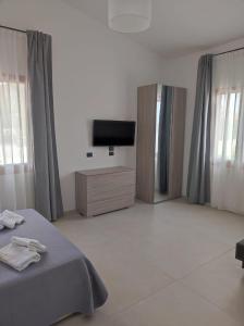 TV a/nebo společenská místnost v ubytování Villa Rita Apartament & Rooms