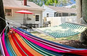 a hammock in a yard next to a house at The Hammock House in Virginia Beach