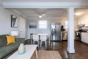a living room and kitchen with a couch and a table at The Hammock House in Virginia Beach