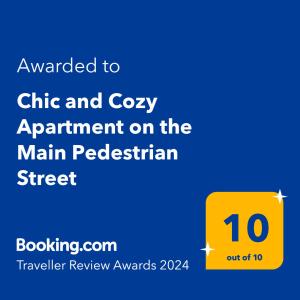 a screenshot of a sign with the text awarded to chi and cozy appointment on at Chic and Cozy Apartment on the Main Pedestrian Street in Struga