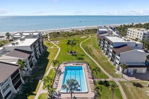an aerial view of a resort with a swimming pool and the ocean at Loggerhead 261 in Sanibel