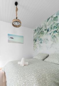 Un ou plusieurs lits dans un hébergement de l'établissement Résidence Nature - Appartements design en centre ville