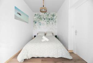 Un ou plusieurs lits dans un hébergement de l'établissement Résidence Nature - Appartements design en centre ville