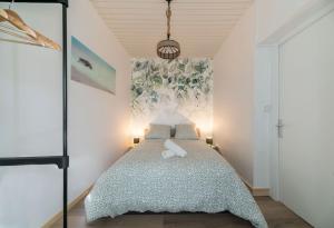 Un ou plusieurs lits dans un hébergement de l'établissement Résidence Nature - Appartements design en centre ville