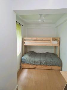 a bedroom with a bunk bed in a room at Rincón del Atlántico in Isla Cristina