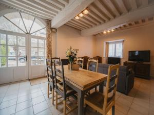 a dining room with a wooden table and chairs at By les Climats - Au coeur du Vignoble - Fixey in Fixin