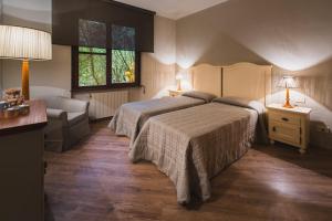 Postel nebo postele na pokoji v ubytování Roccamare Resort - Ville e Appartamenti