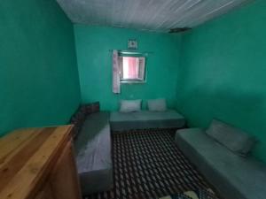 A bed or beds in a room at Gite Ain Bechar