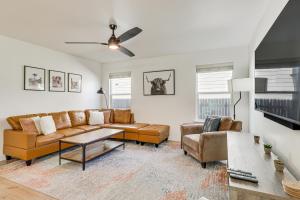 a living room with a couch and a table at Centrally Located Austin Home with Private Patio! in Austin