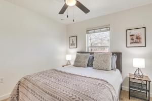 a bedroom with a large bed with two lamps at Centrally Located Austin Home with Private Patio! in Austin