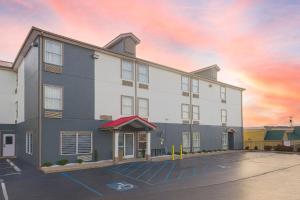 a large white building with a parking lot at Stay 2Night Chattanooga Hamilton Place in Chattanooga
