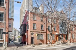 a red brick building on a city street at New! Cozy Apt in Center City! in Philadelphia