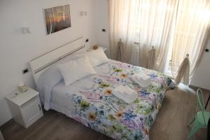 Katil atau katil-katil dalam bilik di Appartamento Via dei Fabbri Navali