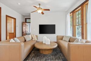 a living room with a couch and a table at Urban Cowboy Villas - Heart of 704 in Austin