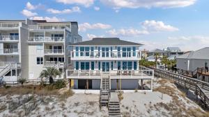 a large white house on the beach at Beachside Bungalow in Destin
