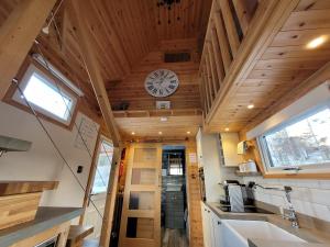 a kitchen with a clock on the ceiling at Sound of Durnamuck in Durnamuck