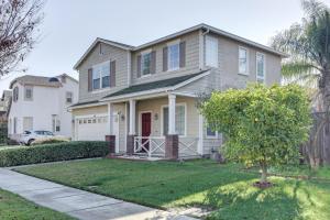 a house with a tree in front of it at Spacious Turlock Home about 1 Mi to University! in Turlock