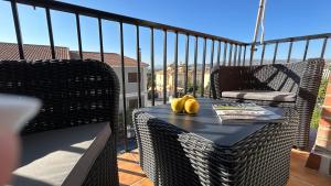 a table on a balcony with bananas on it at Íberos Royal in La Zubia