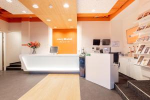 an office with a reception desk and a counter at easyHotel Maastricht City Centre in Maastricht