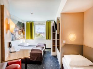 Postel nebo postele na pokoji v ubytování B&B Hotel Weil am Rhein/Basel + 24 fotografií