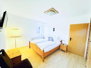 Postel nebo postele na pokoji v ubytování Ferienhaus Am Hofacker