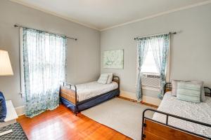 a bedroom with two beds and a window at Charming Hot Springs Home Less Than 2 Mi to Bathhouse Row! in Hot Springs