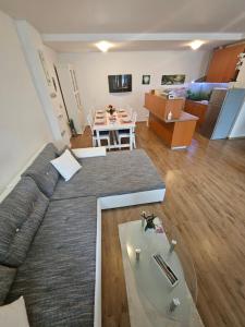 a living room with a couch and a table at Apartment Zoya in Kranjska Gora