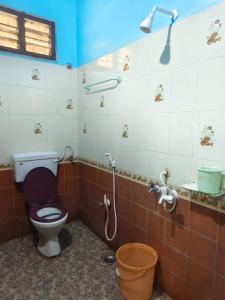 a bathroom with a toilet and a shower at Sri Kanya Residency, Srikalahasti in Srikalahasti