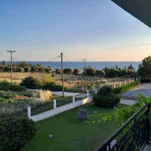a view of the ocean from a balcony at Olive tree 5 bedroom VIlla in Potidaia, Kassandra Chalkidiki in Nea Potidaea