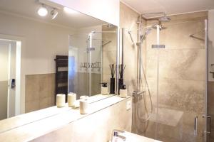 a bathroom with a shower and a glass shower at Smart Resorts Topas 301 in Winterberg