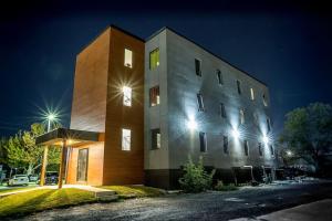 a building with lights on top of it at night at Luxury Boutique 2 Bedroom Condo - 1B in Niagara Falls