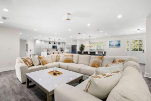 a living room with a couch and a table at Grand Retreat - Luxury Vacation for Large Groups in Fayetteville