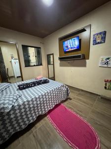 Postel nebo postele na pokoji v ubytování Espaço inteiro - Quarto e cozinha